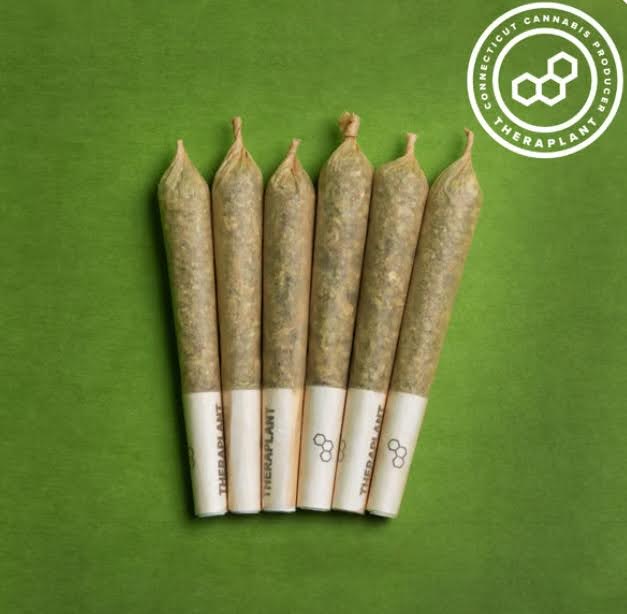 A row of six cannabis pre-rolls. 