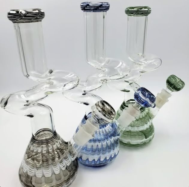 A trio of curved water pipes available at Budr Cannabis.